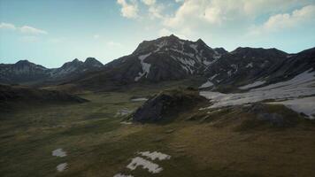 An aerial view of a mountain range with snow video
