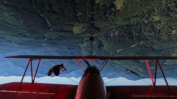 Pilot Performing Loop with Person on Airplane Wing in Flight video