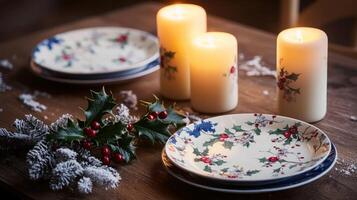 Christmas table setting with candles and holly photo