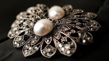 Elegant pearl and silver brooch on black background. photo