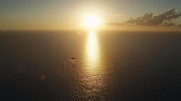 Golden sunset over calm ocean. photo