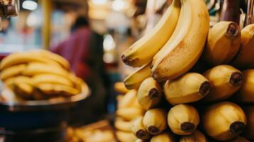 Ripe yellow bananas displayed at a market stall. photo