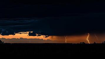 Dramatic lightning strikes illuminate a dark, stormy sky at sunset over a silhouetted landscape. photo