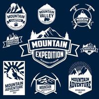 Set of mountains, hiking and outdoor adventures emblems. vector