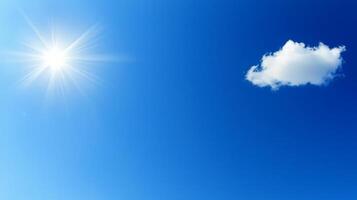 Bright sun and single cloud in a vivid blue sky. photo