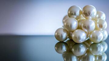 Close-up of lustrous white pearls clustered on a reflective surface. photo