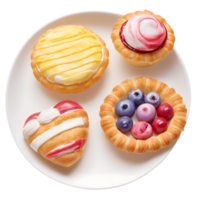 a plate with four different types of pastries png