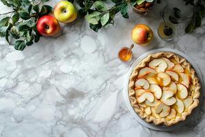 A pie with apples on a marble surface photo