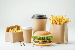 A hamburger, fries and coffee are shown in a paper bag photo
