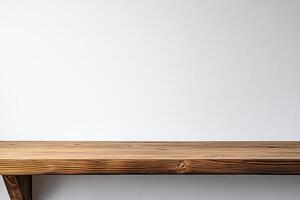A wooden shelf with a white wall behind it photo