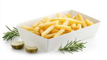 French fries in a white box with rosemary photo