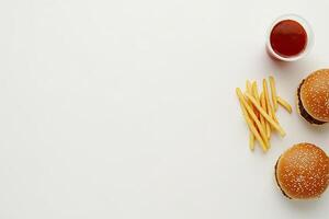 Burger and fries on white background photo