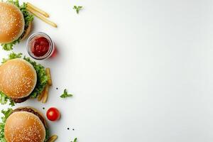 Burger and fries on white background with copy space photo