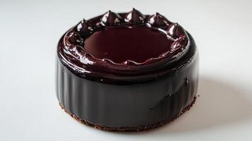 A chocolate cake with a dark chocolate frosting photo