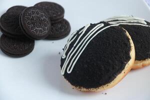 Two oreo donuts on a plate photo