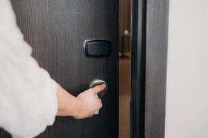 Electronic card key for open door in hotel. Smart card key to lock and unlock door. Security protection concept. photo