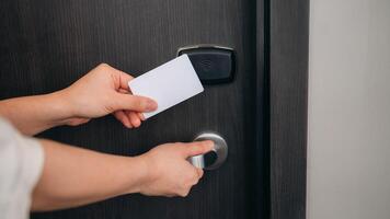 open door in hotel. Smart card key to lock and unlock door. Security systems and protection concept. photo