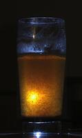 A mysterious spoiled drink with a glowiung light. photo