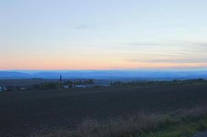 Twilight over a rural landscape in Central Germany Thuringia. Shoot was taken using HDR imaging technique. photo