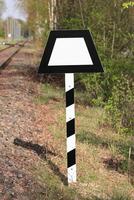 Sign beneath a German railtrack Trapeztafel trapeze panel. photo