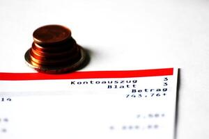 Abstract of account with several Euro coins photo