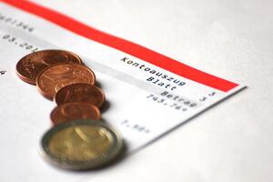 Abstract of account with several Euro coins. photo