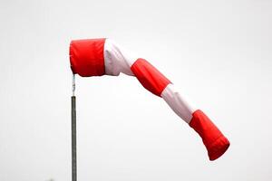 Half filled red-white wind cone. photo