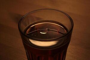 Atmospheric image of a drink with a drop of oil, creating amazing reflections. photo
