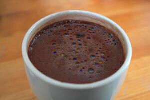Hot chocolate with colorful bubbles. photo