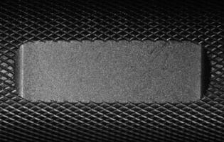 Metallic background with a flat area where a custum writing or logo can easily be applied. photo