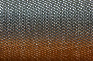 Metallic background with orange and white reflection. photo