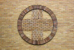 Cross symbol on a church wall. photo