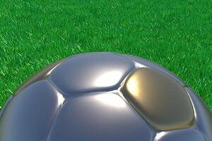 Realistic 3d rendering of a gold and silver football on green grass. photo