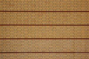 Yellow brick texture with red rows photo