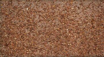 Red gravel texture from wall. photo