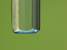 Abstract background from close up of a plastic bar in green light. photo