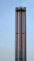 A industrial metal smoke pipe in sundawn. photo