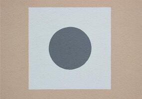 Plaster with square and circle on a house wall. photo