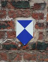 Sign indicating a building protected as cultural heritage in Germany. photo