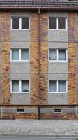 Typical windows in a plattenbau style building from eastern Germany. The Street can be seen at the ground. photo