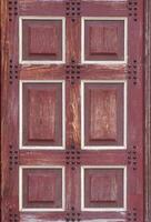 Texture of a wooden door with blanks. photo