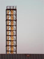 An industrial metal smoke pipe in sundawn. photo