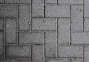 Paved walkway made from concrete blocks usable as background or texture. photo