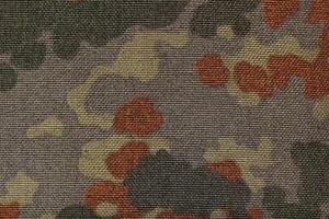 Surface of military camouflage fabric. photo