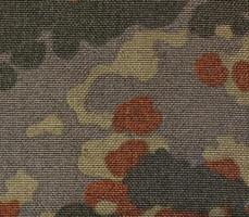 Surface of a military camouflage fabric. photo