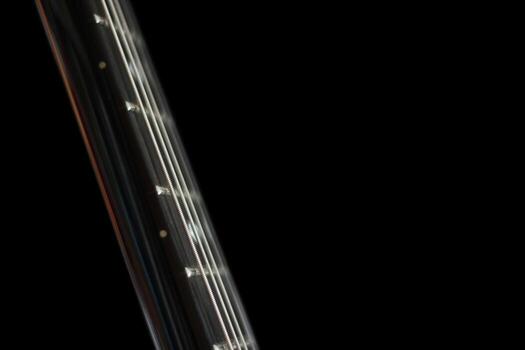 Conceptual dark shot of guitar strings. photo