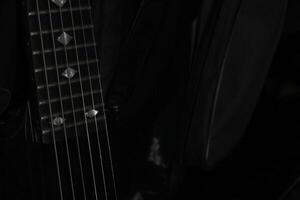 Conceptual lowkey shot of guitar strings. photo