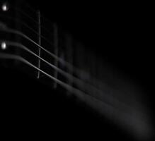 Conceptual low key shot of guitar strings photo