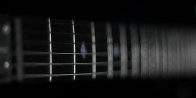 Conceptual dark shot of guitar strings photo