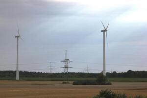 High voltage power lines and wind power stations in Mecklenburg-Vorpommern, Germany. photo